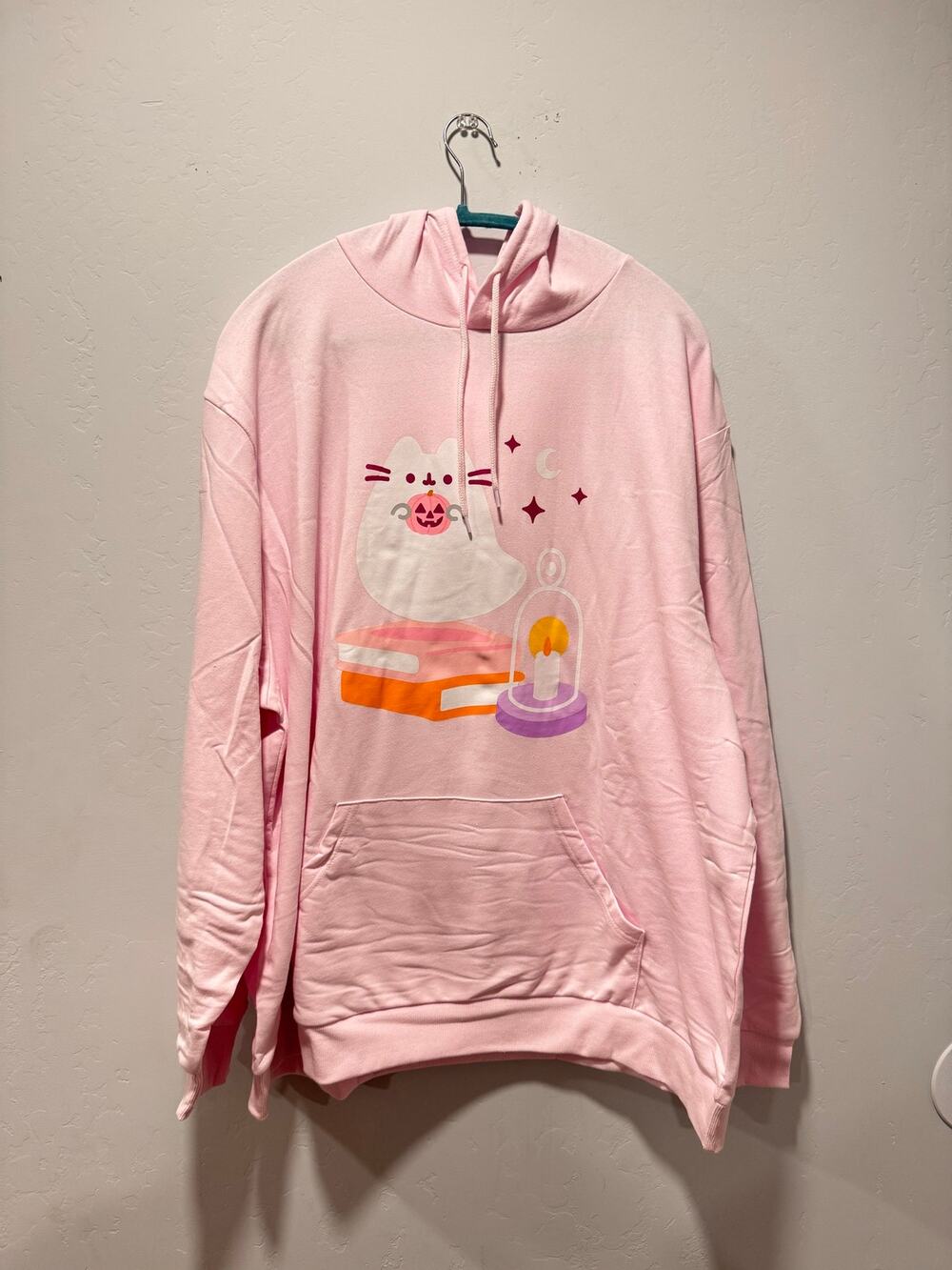 Pink Pusheen sitting on books with a candle Halloween hoodie pocket Size 3XL